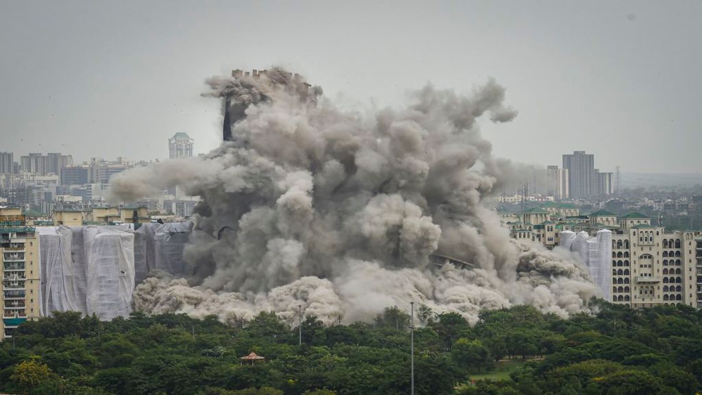 Noida: Demolition of Supertech's twin towers in Noida, on Sunday. (PTI Photo/Shahbaz Khan)