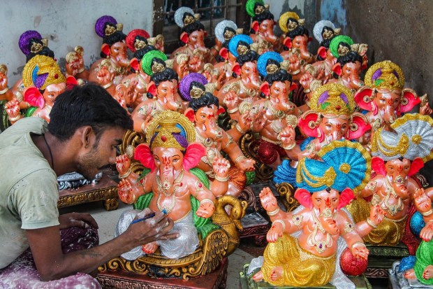 Gurugram: An artist gives final touches to an idol of Lord Ganesha ahead of the Ganesh Chaturthi festival at Vyapar Sadan, in Gurugram, Saturday, Aug. 20, 2022. (PTI Photo)