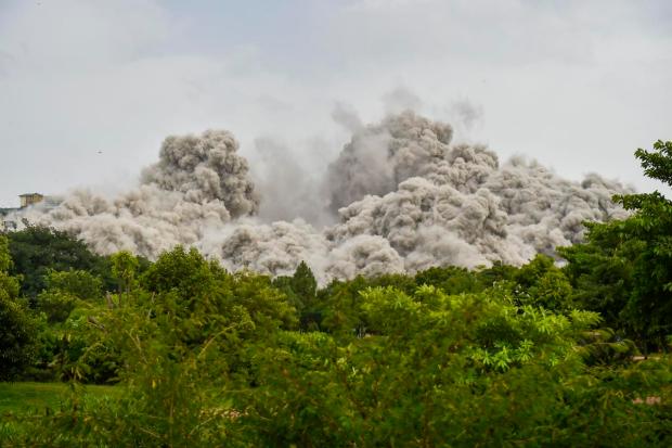 Over 3,700 kg explosives were used to bring down the structures in pursuance of a Supreme Court order that found their construction within the Emerald Court society premises in violation of norms. (PTI Photo)