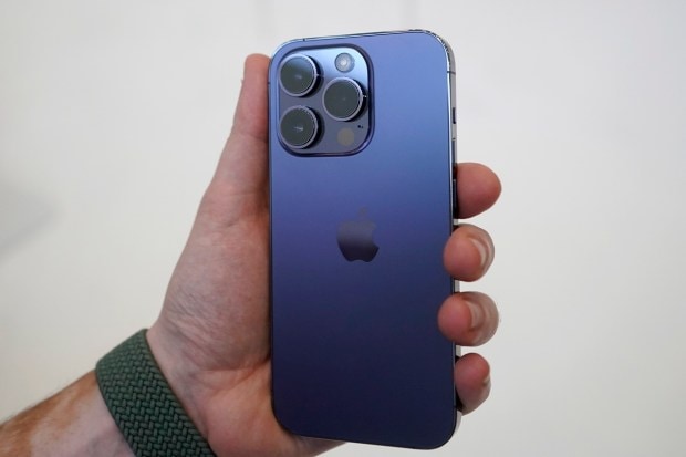 A person holds an iPhone 14 Pro at an Apple event on the campus of Apple's headquarters in Cupertino, Calif., Wednesday, Sept. 7, 2022. (AP Photo)