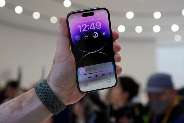 A person holds a new iPhone 14 Pro at an Apple event on the campus of Apple's headquarters in Cupertino, Calif., Wednesday, Sept. 7, 2022. (AP Photo)