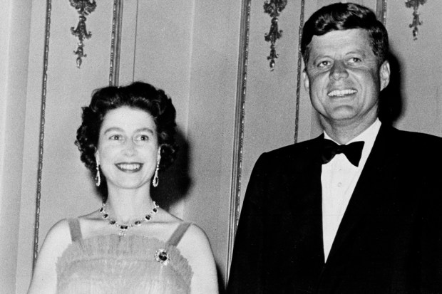 Queen Elizabeth II and U.S. President John Kennedy as they pose at Buckingham Palace in London, June 5, 1961. (AP Photo)