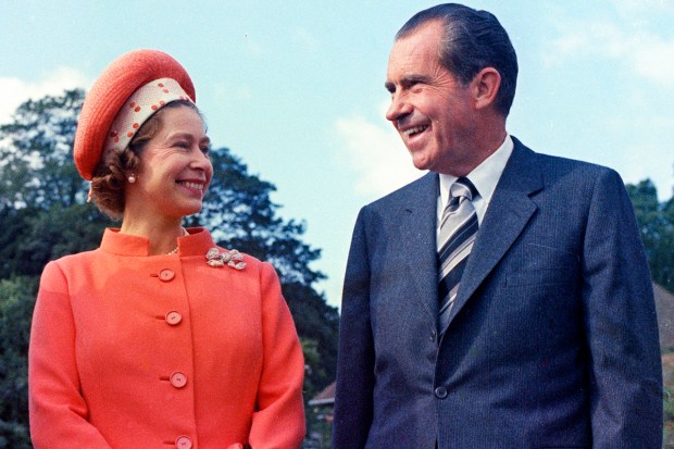In this 1970 photo, Queen Elizabeth II, left, reacts with U.S. President Richard Nixon, at Chequers, in Buckinghamshire, England. (AP Photo)