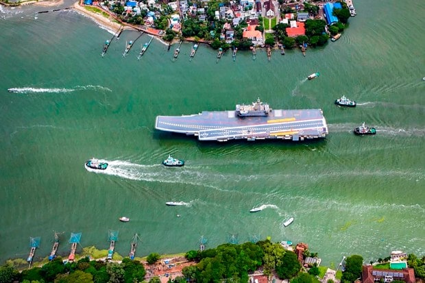 In this handout picture provided by the Indian Navy, INS Vikrant, India's first indigenously-built aircraft carrier, sails for sea trials from Kochi, India, Thursday, Aug. 25, 2022. India on Friday commissioned its first home-built aircraft carrier in its quest to match an aggressive China with a much larger naval fleet. The INS Vikrant (Powerful), the new 262-meter (860-foot) carrier designed by the Indian navy and built at the Cochin shipyard in southern India, was launched by Prime Minister Narendra Modi as part of the country's commemoration of 75 years of independence from British rule. (Indian Navy via AP)