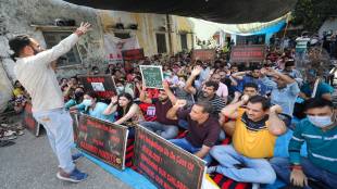 Kashmiri Pandit employees stage protest as they observe 'Balidan Divas' in commemoration of the death of Tika Lal Taploo, in Jammu, on September 13 (PTI Photo/File)