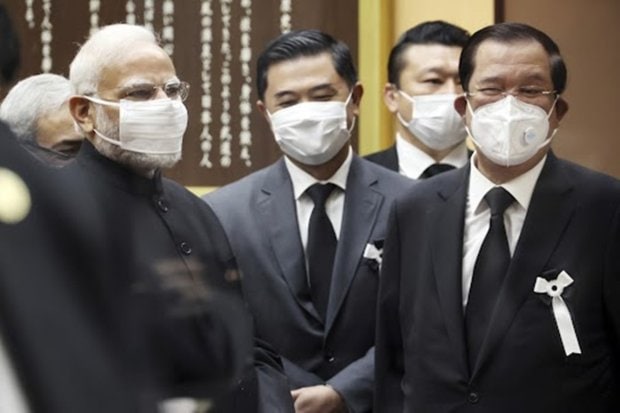 Prime Minister Narendra Modi, left, waits with his Cambodian counterpart Hun Sen after they attended the state funeral for former Prime Minister Shinzo Abe. (Photo: AP)
