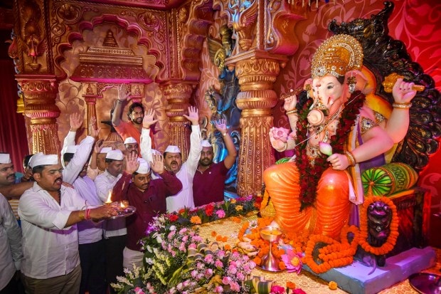 Devotees worship Lord Ganesh on the occasion of Ganesh Chaturthi festival, in Patna. (PTI Photo)