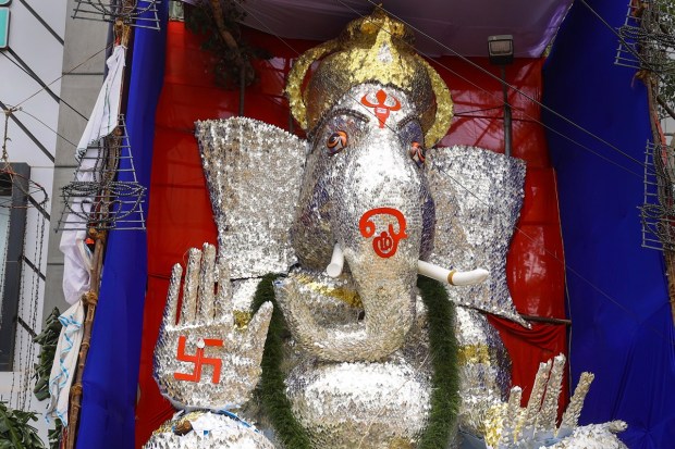 A giant idol of Lord Ganesh prepared using 'Vel', the spear associated with Lord Murugan, made of satin fabric and sticks being displayed at a pandal, on the occasion of Ganesh Chaturthi, in Chennai. (PTI Photo)