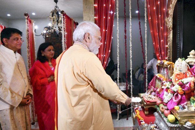 Prime Minister Narendra Modi offer prayers as he participates in 'Ganesh Chaturthi' celebrations at the residence of the Union Minister Piyush Goyal, in New Delhi. (PIB/PTI Photo)