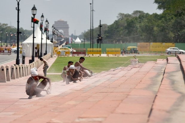 New Delhi: Labourers at work at the Central Vista Avenue, in New Delhi, Tuesday, Sept. 6, 2022. (PTI Photo)