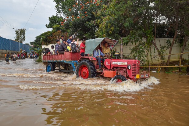 Bengaluru: A tractor being used to evacuate people stranded at the waterlogged Yemalur area after heavy monsoon rains, in Bengaluru, Tuesday, Sept. 6, 2022. (PTI Photo)