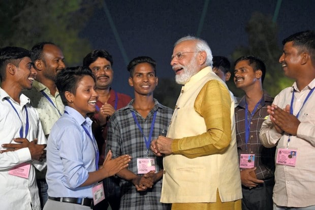 At the event, Modi also met a group of sixteen workers, who were engaged in the redevelopment of the entire stretch, and invited them along with their families as special guests on the 2023 Republic Day Parade. (PTI Photo)