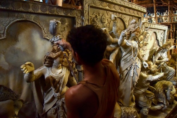 Guwahati: An artist prepares an idol of Goddess Durga in a workshop, ahead of the celebration of Durga Puja, in Guwahati. (PTI Photo)
