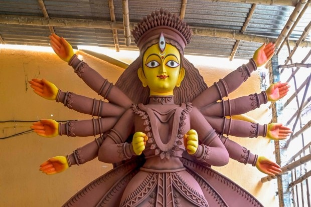 Nadia: Artisans paint a clay idol of Goddess Durga at a workshop, ahead of the celebrations of Durga Puja, in Nadia. (PTI Photo)