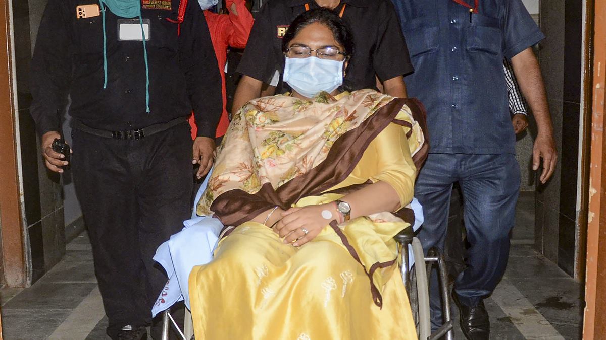Suspended IAS officer Pooja Singhal being arrives on a wheelchair to get admitted at the RIMS hospital in Ranchi on September 28, 2022. (PTI Photo)