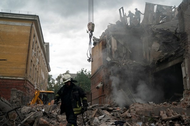 Firefighters work to extinguish a fire, looking for potential victims after a Russian attack that heavily damaged a residential building in Sloviansk, Ukraine, Wednesday, Sept. 7, 2022. (AP Photo)