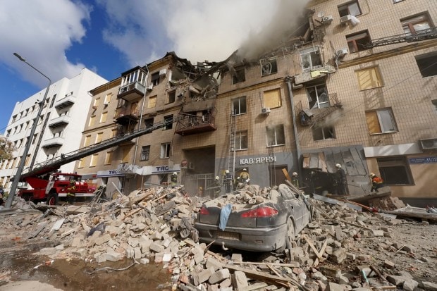 Ukrainian firefighters work on heavily damaged buildings after latest Russian rocket attack in center Kharkiv, Ukraine, Tuesday, Sept. 6, 2022. (AP Photo)