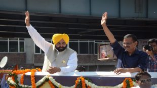 Punjab Chief Minister Bhagwant Mann and Aam Aadmi Party chief Arvind Kejriwal during a roadshow in Amritsar. (Express photo by Rana Simranjit Singh/File)