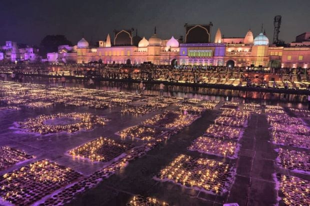 People light earthen lamps at Ram Ki Paidi during Deepotsav celebrations, on the eve of the Diwali festival, in Ayodhya