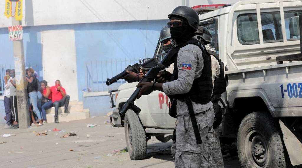 Police block a street during a protest against the government and rising fuel prices, in Port-au-Prince, Haiti October 3, 2022. (Reuters)