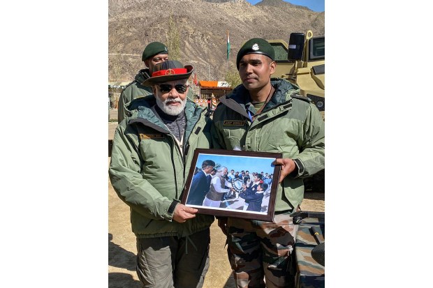 Prime Minister Narendra Modi with Major Amit during Diwali festival celebrations with members of the Armed Forces, in Kargil.