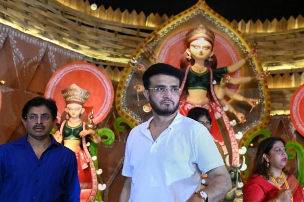 Kolkata: BCCI President Sourav Ganguly with his elder brother and Cricket Association of Bengal (CAB) Secretary Snehasish Ganguly (L) during the inauguration of community Goddess Durga Puja pandal, near his residence. (PTI Photo)