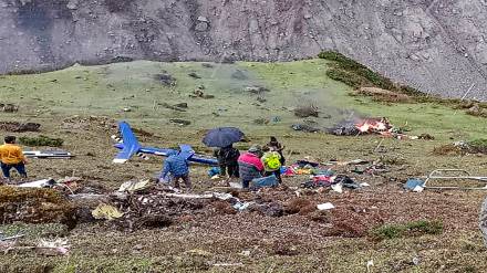 Locals at the site after a helicopter carrying pilgrims crashed near Kedarnath in Uttarakhand, Tuesday. (PTI Photo)