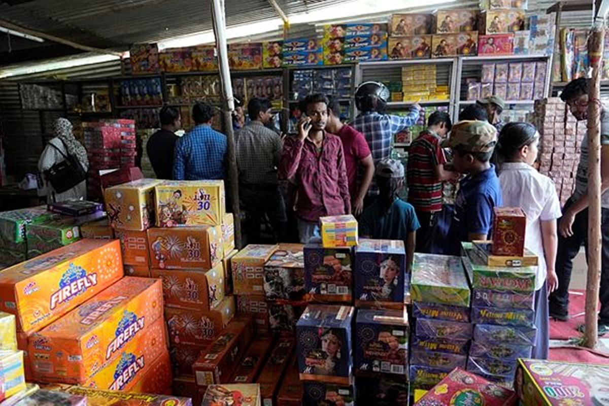 People buy firecrackers ahead of Diwali festival in Prayagraj, in the northern state of Uttar Pradesh, India. (AP Photo/Rajesh Kumar Singh)