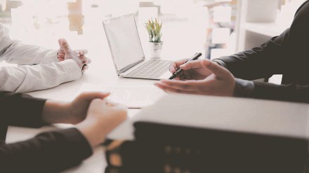 lawyer insurance broker consulting giving legal advice to couple customer about buying renting house. financial advisor with mortgage loan investment contract. Real Estate Agent selling real estate property