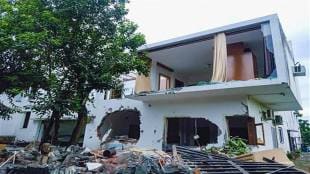 An illegally built resort of a man named Pulkit Arya after it was partially demolished by authorities overnight, in Pauri Garhwal district, on Saturday. (PTI Photo)