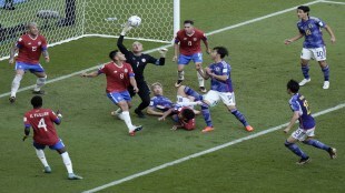 Costa Rica's goalkeeper Keylor Navas reaches for the ball to make a save during the World Cup, group E soccer match between Japan and Costa Rica, at the Ahmad Bin Ali Stadium in Al Rayyan, Qatar (AP Photo)