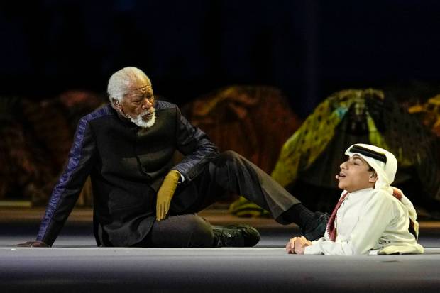 US actor Morgan Freeman, left, sits on the stage next to FIFA World Cup Ambassador Ghanim Al Muftah, at the opening ceremony prior at the Al Bayt Stadium in Al Khor. (AP Photo)