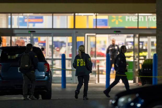 Law enforcement, including the FBI, work the scene of a mass shooting at a Walmart. (AP/PTI Photo)