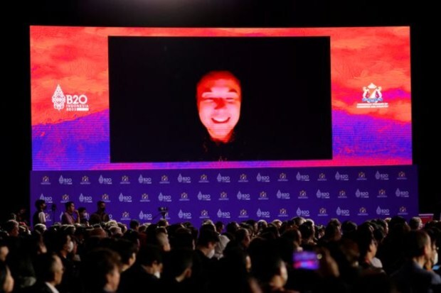 Tesla CEO Elon Musk is seen on the screen as he speaks virtually during the B20 Summit, ahead of the G20 leaders' summit, in Nusa Dua, Bali, Indonesia, November 14, 2022. (Photo source: Reuters)