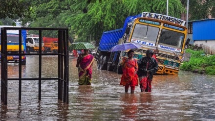 Commuters wade through a waterlogged road amid rainfall, in Chennai, on Tuesday, November 1, 2022. (PTI Photo/R Senthil Kumar)
