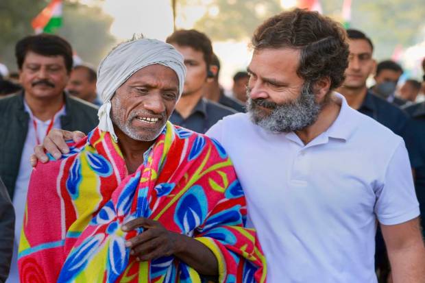 Congress leader Rahul Gandhi interacts with a local supporter during the Bharat Jodo Yatra in Khandwa, Madhya Pradesh. (PTI Photo)