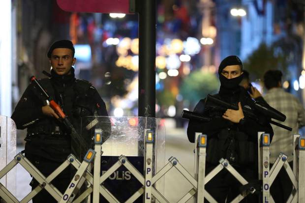 Police officers stand at the entrance the street after an explosion on Istanbul's popular pedestrian Istiklal Avenue, late Sunday, Nov. 13, 2022. A bomb rocked on a major pedestrian avenue in the heart of Istanbul on Sunday, killing six people, wounding dozens and sending people fleeing the fiery explosion. Emergency vehicles rushed to the scene on Istiklal Avenue, a popular thoroughfare lined with shops and restaurants that leads to the iconic Taksim Square.(Photo source: AP)