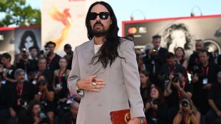 Michele’s fashions, recognizable for their flamboyant, bohemian-chic designs, have been worn by various celebrities