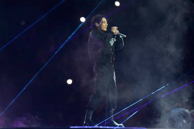 BTS singer Jung Kook performs during the opening ceremony, prior to the group A soccer match between Qatar and Ecuador, at the Al Bayt Stadium in Al Khor , Qatar. (AP Photo)