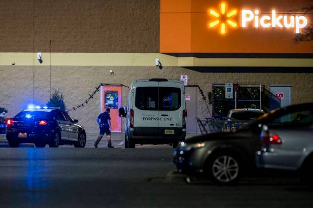 The forensic unit respond to the scene of a mass shooting at a Chesapeake. (AP Photo)