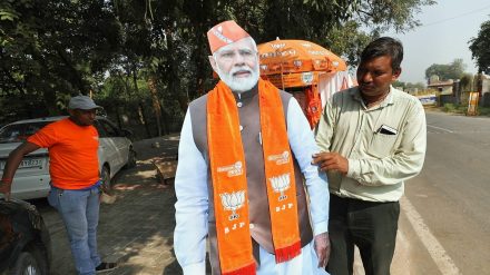 Sale of BJP's election materials and other merchandise for party supporters outside BJP headquarters in Gandhinagar on Monday. (Express photo by Nirmal Harindran).
