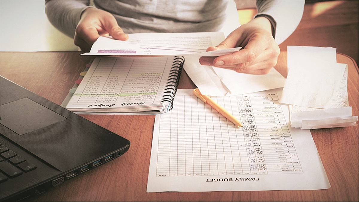 Sad woman with unpaid bills has many debts. Unemployment and personal bankruptcy. Financial crisis and unemployment. Family budget, Saving money Sad woman with unpaid bills has many debts. Unemployment and personal bankruptcy. Financial crisis and unemployment. Family budget, Saving money