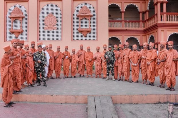 Saints of Swaminarayan Gurukul after casting their votes during the first phase of Gujarat Assembly elections in Surat. (Image/PTI)