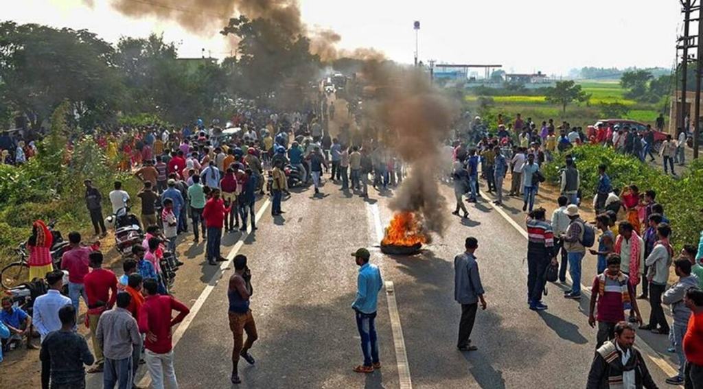 Bogtui villagers burn tyres and block NH-14 on Tuesday. (Photo: PTI)