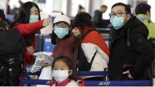 China students return home amid COVID travel spread fears