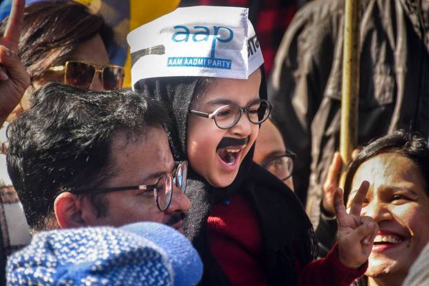 AAP supporters celebrate MCD election results at the party head-office, in New Delhi. (PTI Photo)