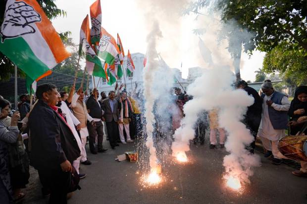 Lucknow: Congress workers burn firecrackers to celebrate the party's decisive lead in Himachal Pradesh Assembly Election, at the party office in Lucknow. (PTI Photo)