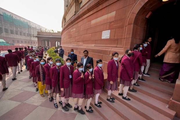 School students visit the Parliament House complex wearing face masks, amid a sudden spurt in COVID cases in China and some other countries, in New Delhi. (PTI)