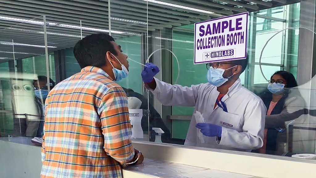 An air passenger gives sample for COVID-19 tests at the airport, in Kolkata. (PTI Photo/File)
