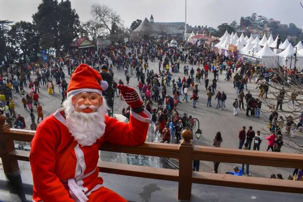 Shimla: Tourists visit at Ridge on the occasion of Christmas, in Shimla. (PTI Photo)
